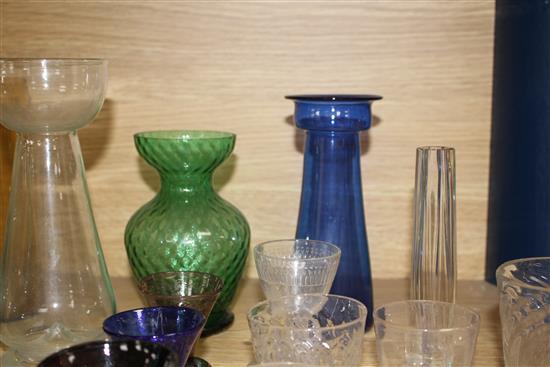 Seven Edwardian coloured glass hyacinth vases, a slender specimen vase and a thirteen other assorted glasses